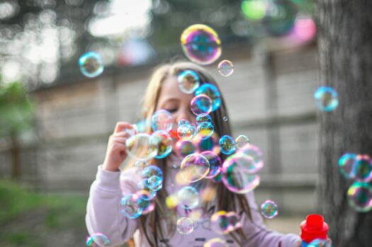 Toddler bubble blowing